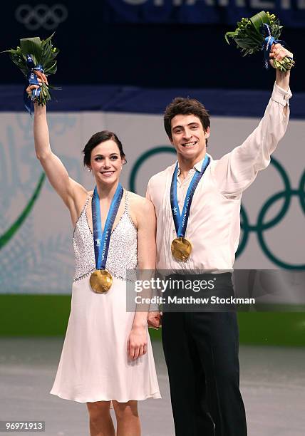 Tessa Virtue and Scott Moir of Canada pose with their gold medal after they won the Ice Dance competition on day 11 of the 2010 Vancouver Winter...