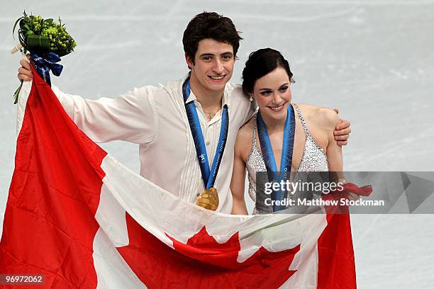 Tessa Virtue and Scott Moir of Canada pose with their gold medals after they won the Ice Dance competition on day 11 of the 2010 Vancouver Winter...