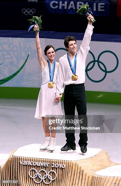 Tessa Virtue and Scott Moir of Canada pose with their gold medals after they won the Ice Dance competition on day 11 of the 2010 Vancouver Winter...