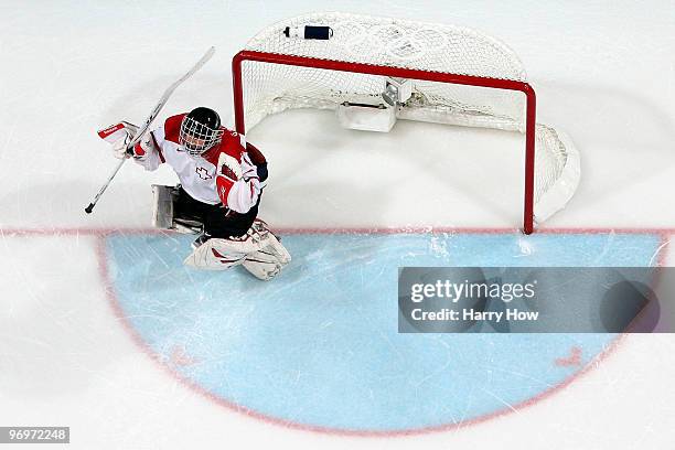 Goalie Florence Schelling of Switzerland celebrates after she made the game-winning save in the shoot out against Russia during the ice hockey...