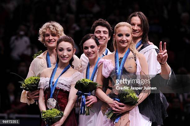 Tessa Virtue and Scott Moir of Canada pose with their gold medals after they won the Ice Dance competition on day 11 of the 2010 Vancouver Winter...