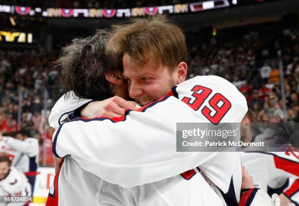 Alex Ovechkin and Alex Chiasson of the Washington Capitals embrace in celebration of winning the Stanley Cup after the Capitals defeated the Vegas...