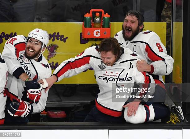 Chandler Stephenson, Nicklas Backstrom and Alex Ovechkin of the Washington Capitals celebrate their 4-3 win over the Vegas Golden Knights as time...