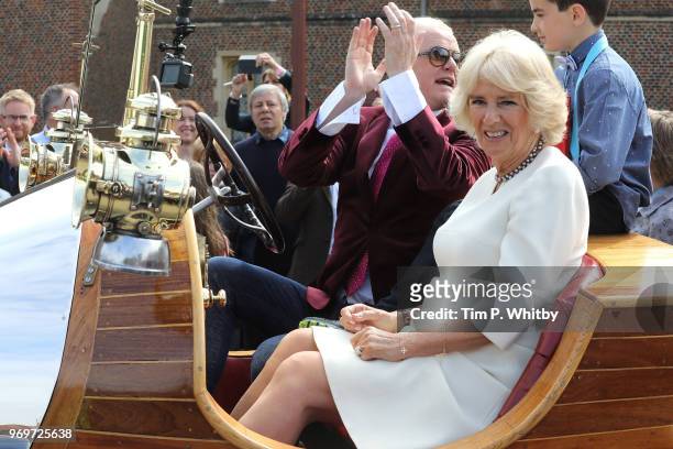 Camilla, Duchess of Cornwall and Chris Evans depart in 'Chitty Chitty Bang Bang' after attending the live broadcast of the final of BBC Radio 2's 500...