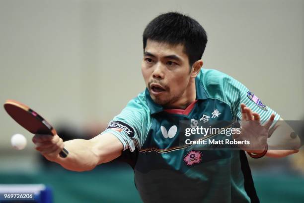 Chih-Yuan Chuang of Chinese Taipei competes Simon Gauzy of Franc against during the men's singles match on day one of the ITTF World Tour LION Japan...