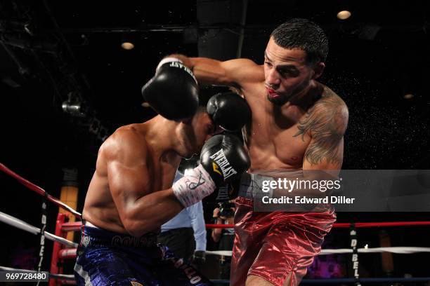 Ray Velez throws a right hand against Daniel Gonzalez at B.B. King Blues Club & Grill in New York City on July 23, 2014. Gonzalez would win by...