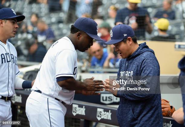 Kazuhisa Makita of the San Diego Padres and Jose Pirela bow before a baseball game against the Miami Marlins at PETCO Park on May 31, 2018 in San...