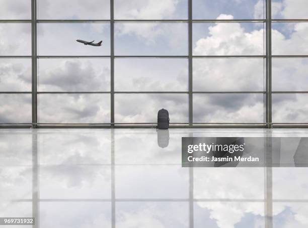 bag and airplane on airport - airport empty gate stock pictures, royalty-free photos & images