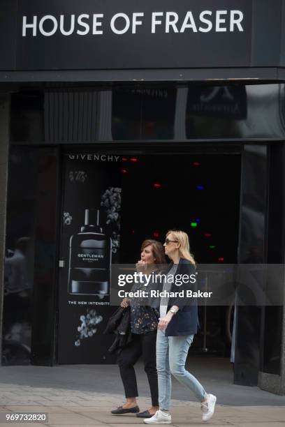 On the day that closures of many branches and the loss of jobs, shoppers are outside The House of Fraser department store on Oxford Street which has...