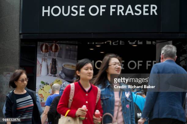 On the day that closures of many branches and the loss of jobs, shoppers are outside The House of Fraser department store on Oxford Street which has...