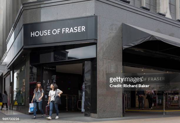 On the day that closures of many branches and the loss of jobs, shoppers are outside The House of Fraser department store on Oxford Street which has...