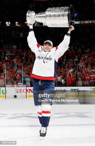 Jakub Vrana of the Washington Capitals lifts the Stanley Cup in celebration after his team defeated the Vegas Golden Knights 4-3 in Game Five of the...