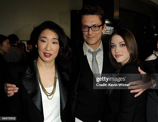 Actress Sandra Oh, writer/director Peter Stebbings and actress Kat Dennings arrive at the premiere of "Defendor" at the Landmark Theater on February...