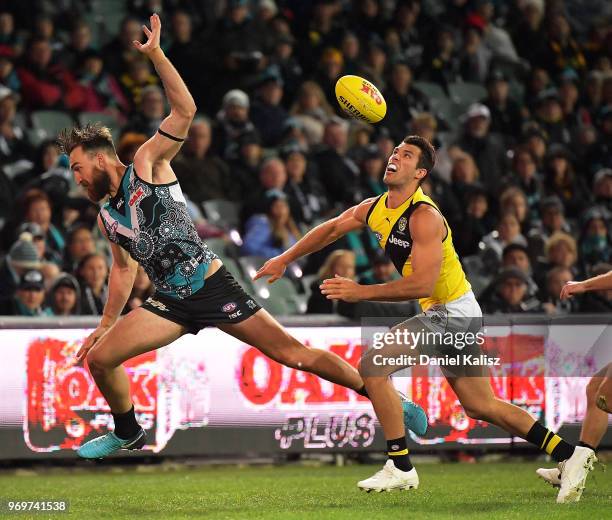 Charlie Dixon of the Power competes for the ball with Alex Rance of the Tigers during the round 12 AFL match between the Port Adelaide Power and the...