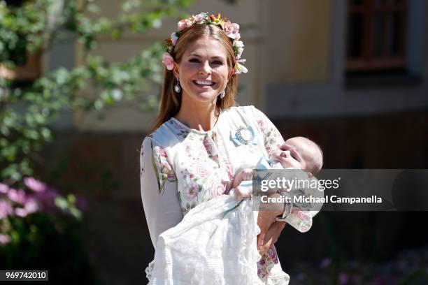 Princess Madeleine of Sweden holding Princesse Adrienne of Sweden, leaves the christening of Princess Adrienne of Sweden at Drottningholm Palace...