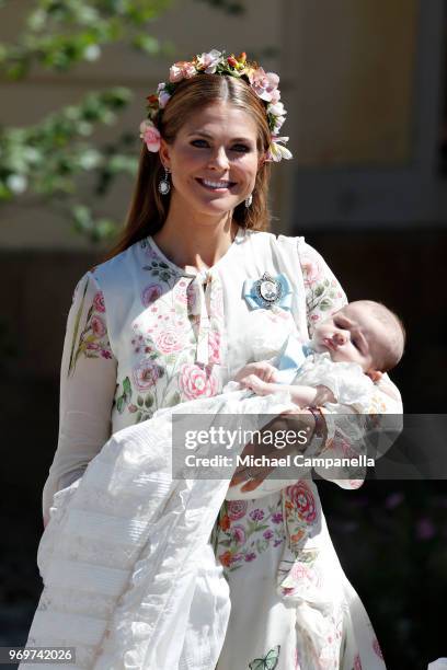 Princess Madeleine of Sweden holding Princesse Adrienne of Sweden, leaves the christening of Princess Adrienne of Sweden at Drottningholm Palace...