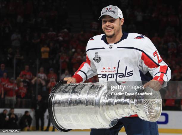 Madison Bowey of the Washington Capitals holds the Stanley Cup in celebration after his team defeated the Vegas Golden Knights 4-3 in Game Five of...