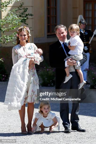 Princess Madeleine of Sweden, holding Princess Adrienne of Sweden, Princess Eleonore of Sweden and Christopher O'neil holding Prince Nicolas of...