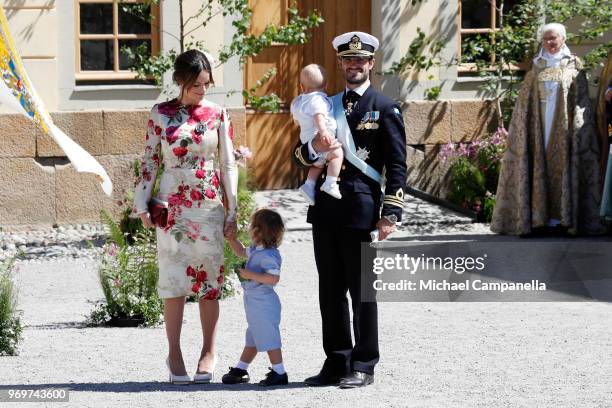 Princess Sofia of Sweden,Prince Alexander of Sweden and Prince Carl Phillip of Sweden holding Prince Gabriel of Sweden pose after the christening of...