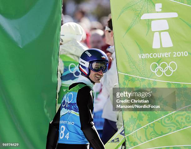 Adam Malysz of Poland looks on during the men's ski jumping team event on day 11 of the 2010 Vancouver Winter Olympics at Whistler Olympic Park Ski...