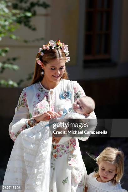 Princess Madeleine of Sweden holding Princesse Adrienne of Sweden, leaves the christening of Princess Adrienne of Sweden at Drottningholm Palace...