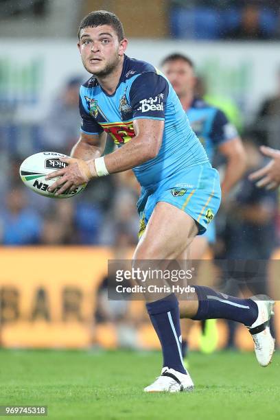Ash Taylor of the Titans runs the ball during the round 14 NRL match between the Gold Coast Titans and the South Sydney Rabbitohs at Cbus Super...