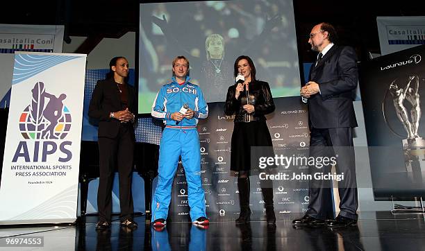 Russia's figure skating silver medallist Evgeni Plushenko with Laureus Academy member Katarina Witt during the Laureus/AIPS Media event at Casa...