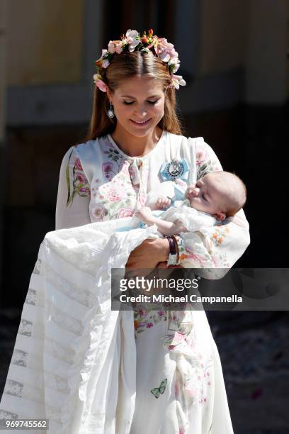 Princess Madeleine of Sweden holding Princesse Adrienne of Sweden, leaves the christening of Princess Adrienne of Sweden at Drottningholm Palace...