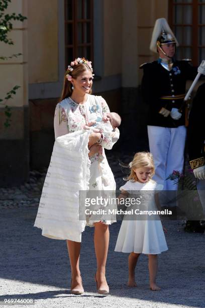 Princess Madeleine of Sweden, holding Princess Adrienne of Sweden and Princess Eleonore of Sweden leave after the christening of Princess Adrienne of...