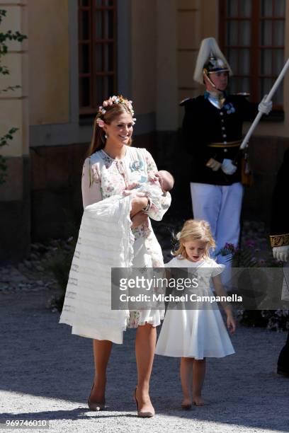 Princess Madeleine of Sweden, holding Princess Adrienne of Sweden and Princess Eleonore of Sweden leave after the christening of Princess Adrienne of...