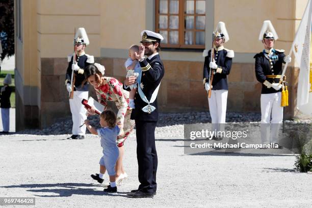 Princess Sofia of Sweden,Prince Alexander of Sweden and Prince Carl Phillip of Sweden holding Prince Gabriel of Sweden pose after the christening of...