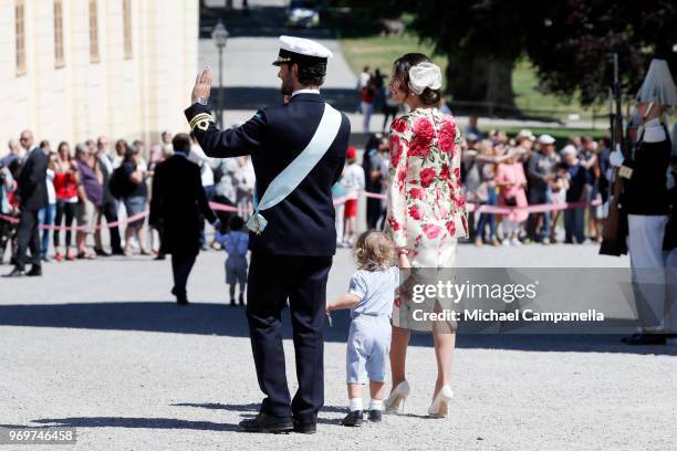 Princess Sofia of Sweden,Prince Alexander of Sweden and Prince Carl Phillip of Sweden holding Prince Gabriel of Sweden pose after the christening of...