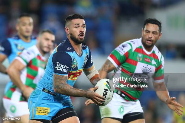 Nathan Peats of the Titans runs the ball during the round 14 NRL match between the Gold Coast Titans and the South Sydney Rabbitohs at Cbus Super...