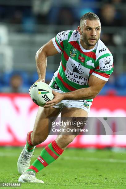 Robbie Farah of the Rabbitohs passes during the round 14 NRL match between the Gold Coast Titans and the South Sydney Rabbitohs at Cbus Super Stadium...