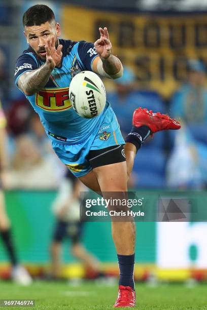 Nathan Peats of the Titans passes during the round 14 NRL match between the Gold Coast Titans and the South Sydney Rabbitohs at Cbus Super Stadium on...