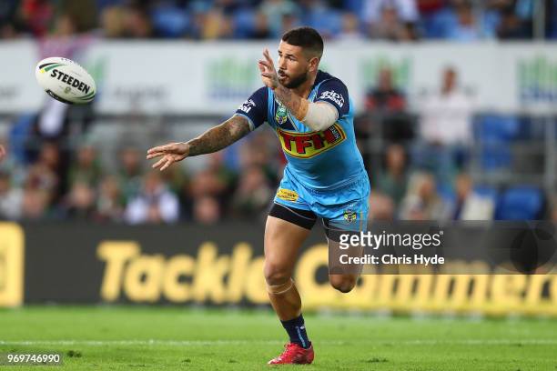Nathan Peats of the Titans passes during the round 14 NRL match between the Gold Coast Titans and the South Sydney Rabbitohs at Cbus Super Stadium on...