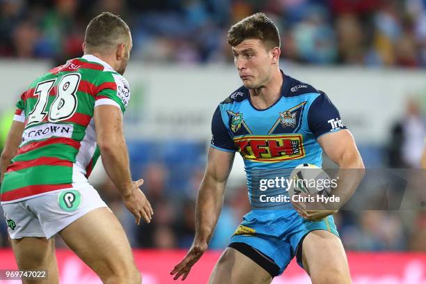 Jai Arrow of the Titans runs the ball during the round 14 NRL match between the Gold Coast Titans and the South Sydney Rabbitohs at Cbus Super...