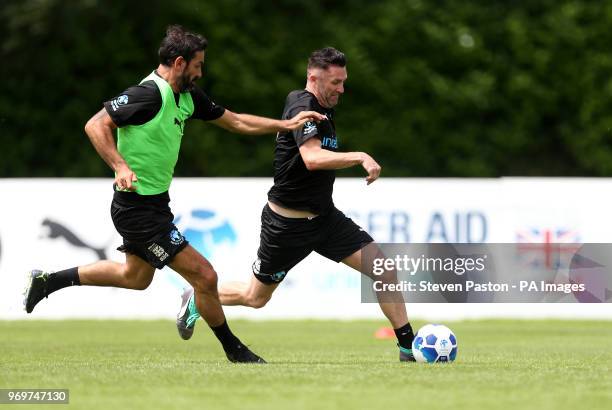 Robbie Keane and Robert Pires during the training session during the Soccer Aid for UNICEF training session at Motspur Park, London.