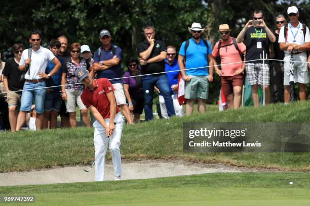 Matthias Schwab of Austria chips out of a bunker on the 4th hole during day two of The 2018 Shot Clock Masters at Diamond Country Club on June 8,...