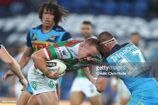 Jason Clark of the Rabbitohs runs the ball during the round 14 NRL match between the Gold Coast Titans and the South Sydney Rabbitohs at Cbus Super...