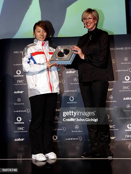 Korean speed skater and gold medallist Sang Hwa Lee is presented with a gift from an AIPS member during the Laureus/AIPS Media event at Casa Italia...