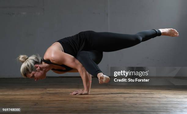 Yoga teacher and Wales and Ospreys Rugby Union player Alecs Donovan pictured demonstrating a Side Crow (Parsva bakasana during a Yoga session at...