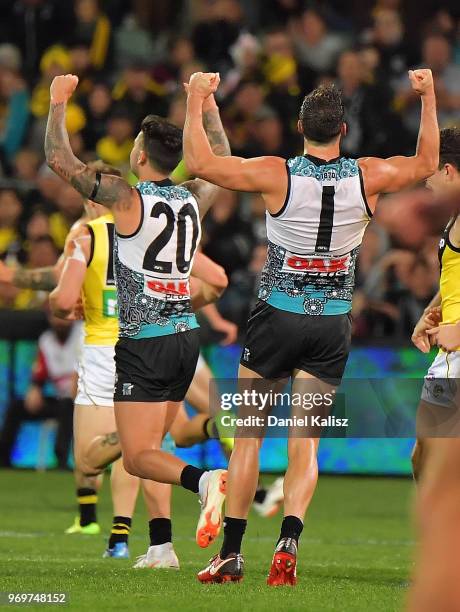 Chad Wingard of the Power and Travis Boak of the Power celebrate after the final siren during the round 12 AFL match between the Port Adelaide Power...