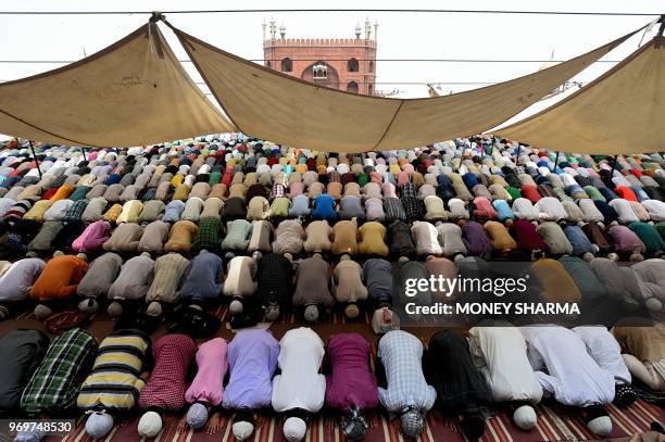 Indian Muslims pray during the last Friday of the holy month of Ramadan at the Jama Masjid in the old quarters of New Delhi on June 8, 2018. - Like...