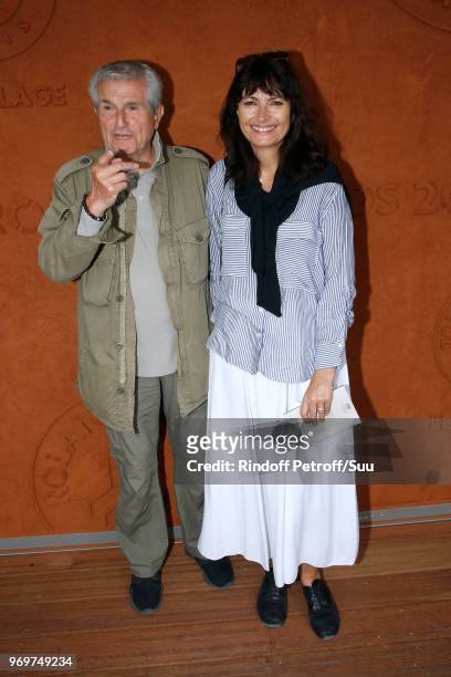 Director Claude Lelouch and his companion Valerie Perrin attend the 2018 French Open - Day Thirteen at Roland Garros on June 8, 2018 in Paris, France.