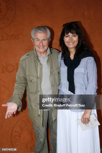 Director Claude Lelouch and his companion Valerie Perrin attend the 2018 French Open - Day Thirteen at Roland Garros on June 8, 2018 in Paris, France.