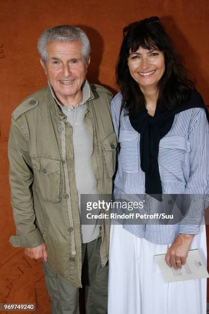 Director Claude Lelouch and his companion Valerie Perrin attend the 2018 French Open - Day Thirteen at Roland Garros on June 8, 2018 in Paris, France.