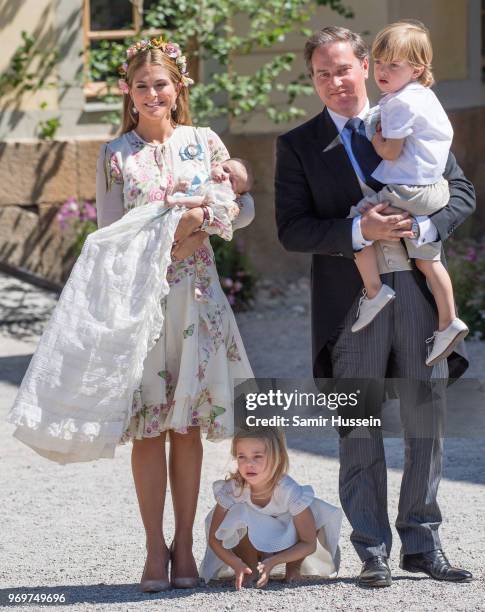 Princess Madeleine of Sweden, holding Princess Adrienne of Sweden, Princess Eleonore of Sweden and Christopher O'Neill holding Prince Nicolas of...