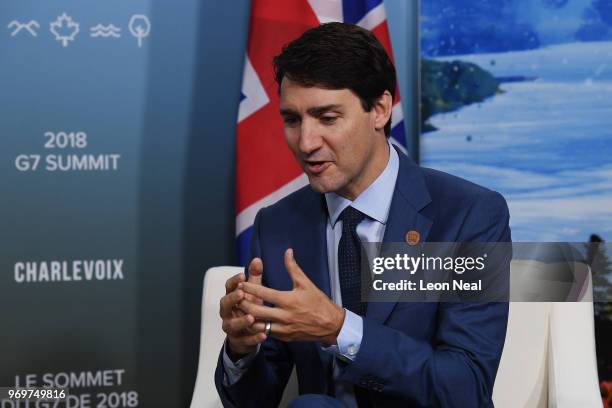 Canadian Prime Minister Justin Trudeau is seen as he meets his British counterpart Theresa May on the first day of the G7 Summit, on 8 June, 2018 in...