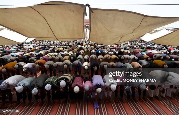 Indian Muslims pray during the last Friday of the holy month of Ramadan at the Jama Masjid in the old quarters of New Delhi on June 8, 2018. - Like...